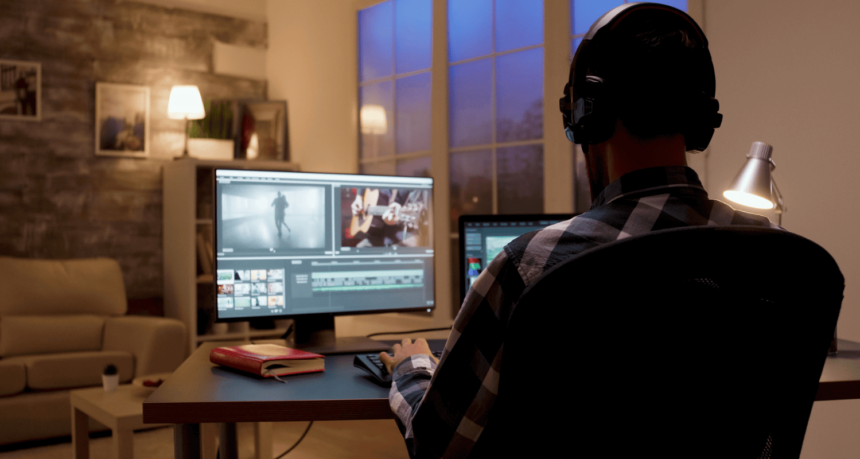 a movie editor is editing a movie while at home during night