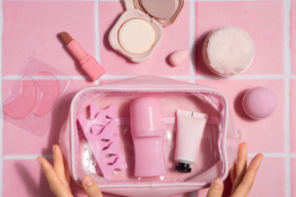 Vibrant beauty product set in a pink makeup bag, featuring skincare, makeup, and tools from top skincare companies 2025.