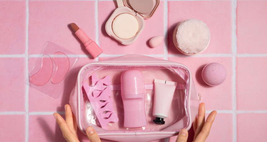 Vibrant beauty product set in a pink makeup bag, featuring skincare, makeup, and tools from top skincare companies 2025.