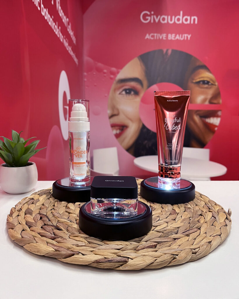Givaudan fragrance and beauty products displayed on table.